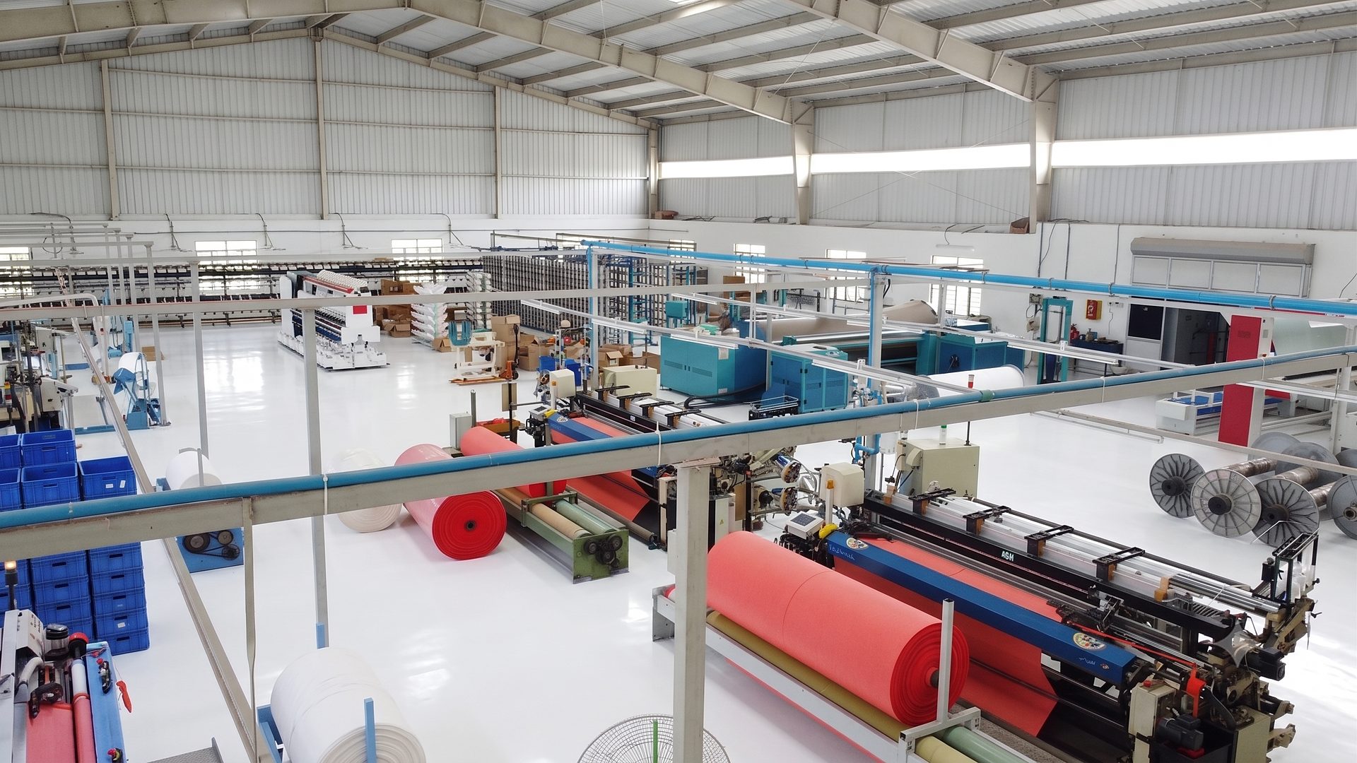 Greendrops production floor with looms and fabric rolls